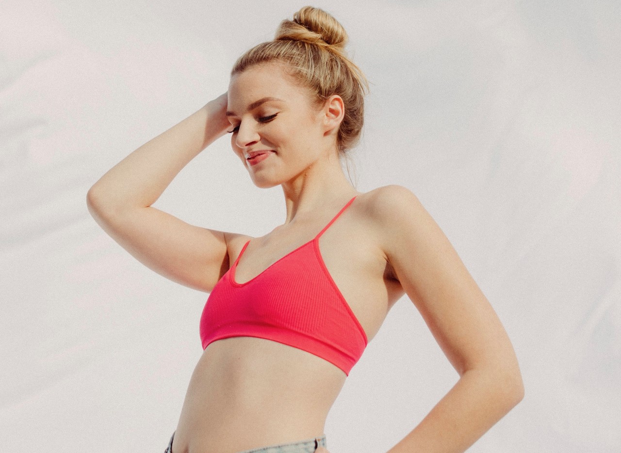 Woman wearing a pink bra